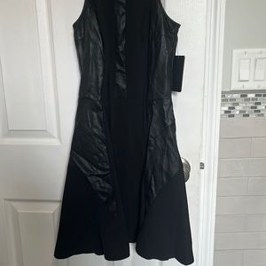 Very cute spandex - polyester - faux leather look black fitted and slight flare